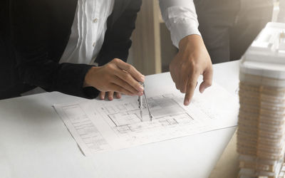 Close-up of hands on paper