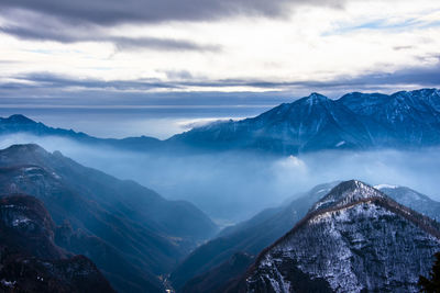 Scenic view of snowcapped mountains against sky