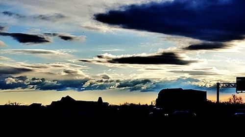 Scenic view of landscape against cloudy sky