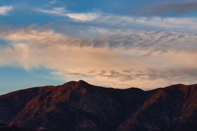 Scenic view of mountains against sky during sunset