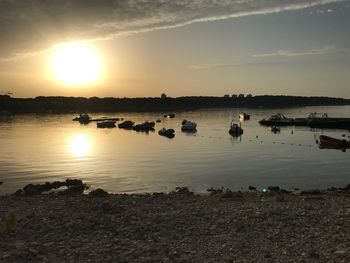 Scenic view of lake against sky during sunset