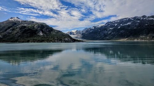 Scenic view of lake and mountains against sky