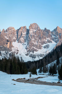 Scenic view of snowcapped mountains against clear blue sky