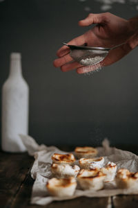 Woman doing homemade pastries portugueseceo cake pastel de nata on table