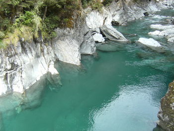 High angle view of rock formation in sea