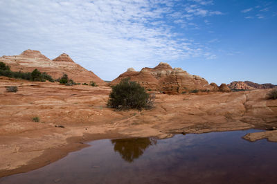Rock formations on landscape against sky