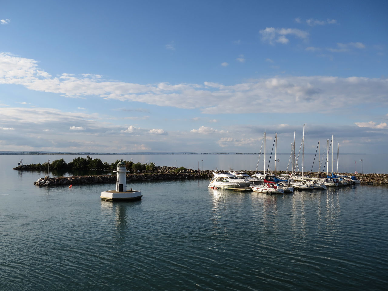 nautical vessel, transportation, water, boat, mode of transport, sea, sky, waterfront, moored, tranquility, tranquil scene, nature, horizon over water, sailing, scenics, beauty in nature, cloud - sky, travel, sailboat, mast