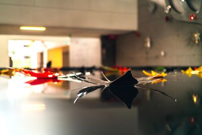 Close-up of red working on table