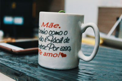 Close-up of coffee cup on table