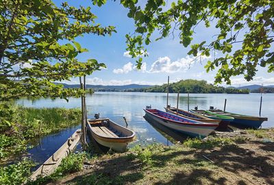 Boats moored in lake