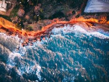 High angle view of water flowing over sea