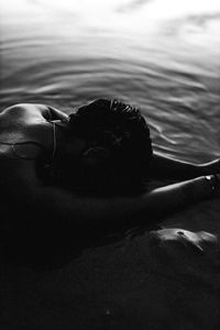 Woman lying down at beach