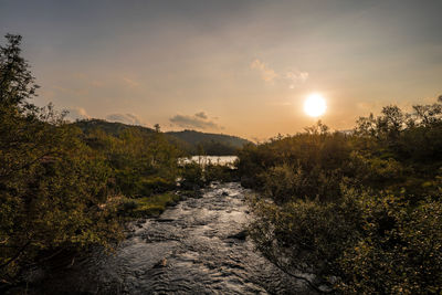 Scenic view of landscape against sky during sunset