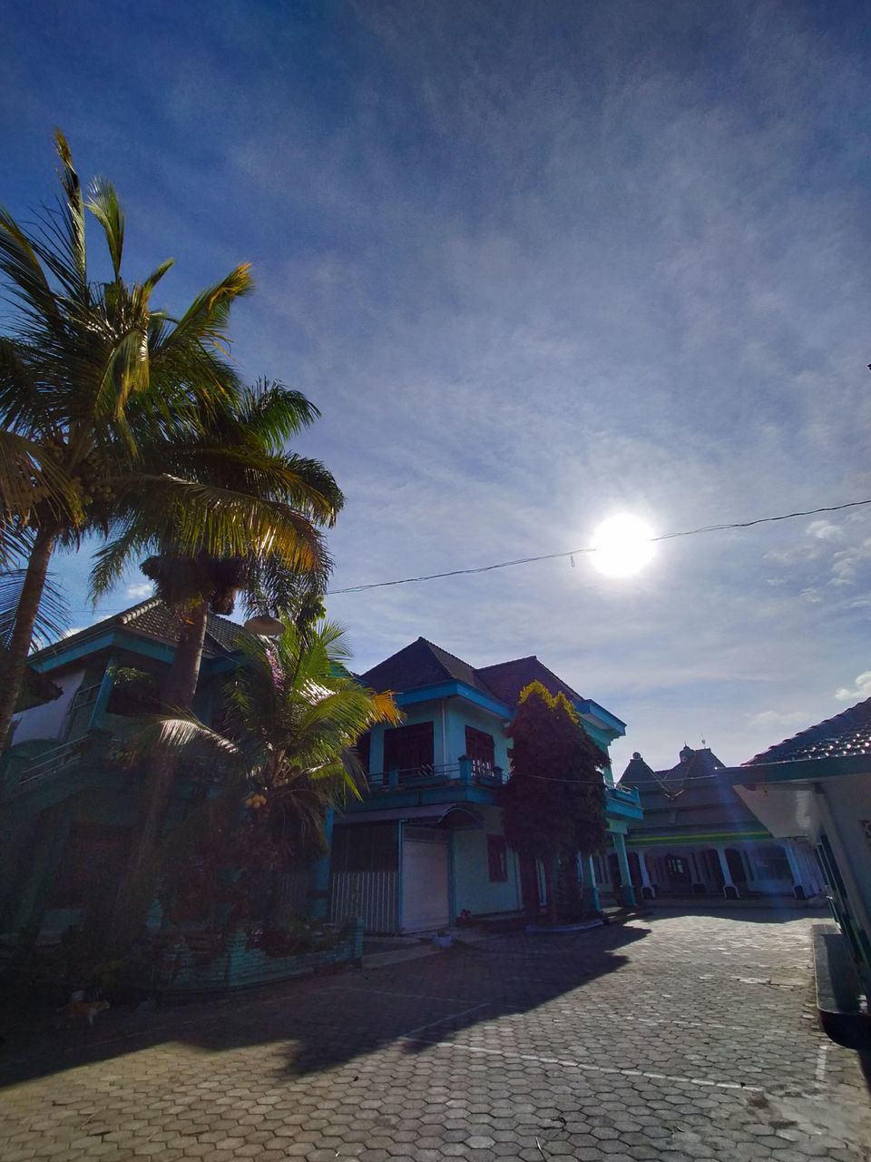 HOUSES AND TREES AGAINST SKY