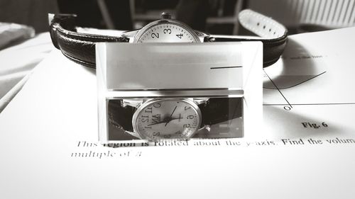 Close-up of clock on table