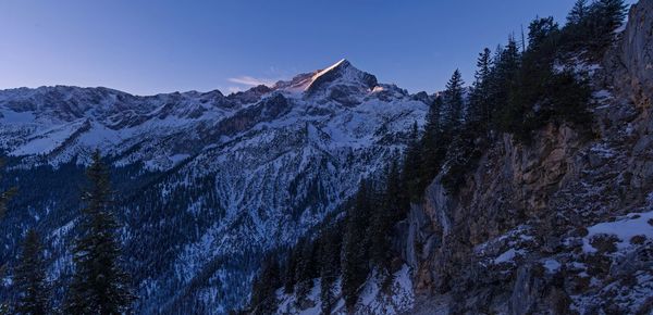 Scenic view of snowcapped mountains against sky