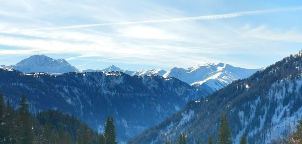 Scenic view of snowcapped mountains against sky