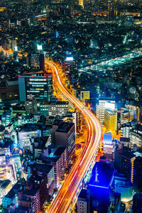 High angle view of light trails on city street at night