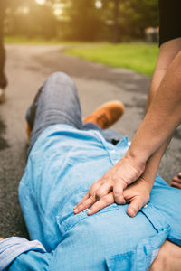 Low section of man sitting on floor