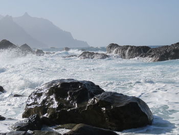 Waves splashing on rocks