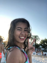 Smiling young girl on the beach