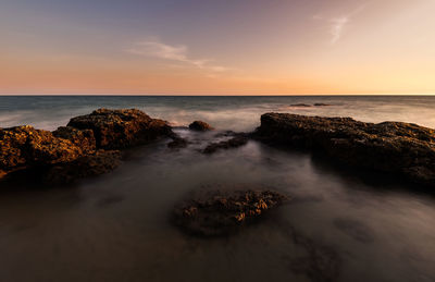 Scenic view of sea against sky during sunset