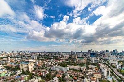 High angle view of city against cloudy sky