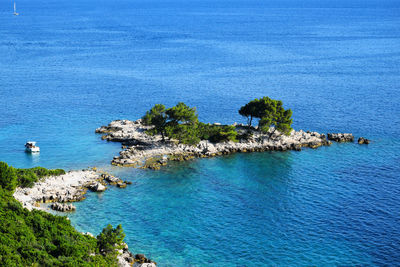 High angle view of rocks by sea