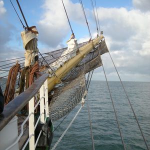 Low angle view of ship on sea against sky