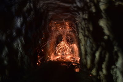 Close-up of illuminated fire crackers at night