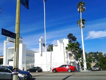 View of city street against blue sky