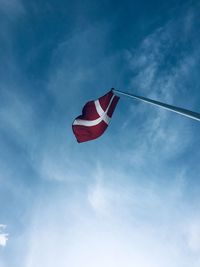 Low angle view of danish flag against sky