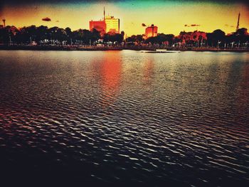 Reflection of illuminated buildings in water at night