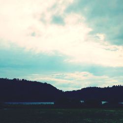 Scenic view of silhouette landscape against sky at sunset