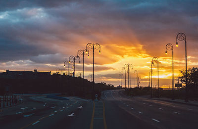 Street against sky during sunset