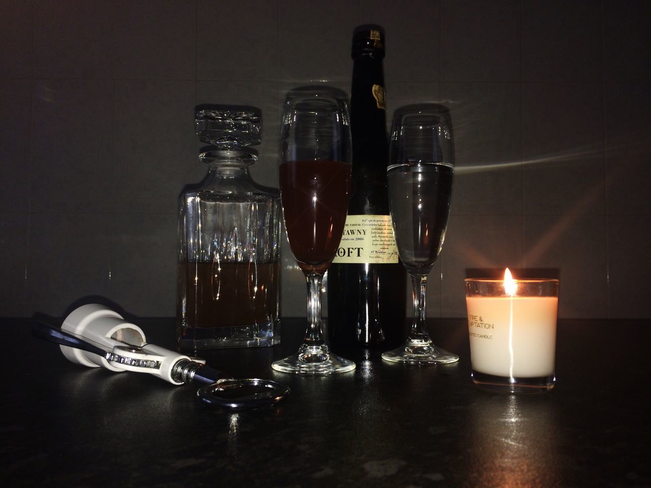 candle, bottle, flame, table, indoors, burning, no people, drink, illuminated, close-up, day