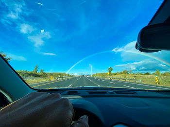 Road seen through car windshield