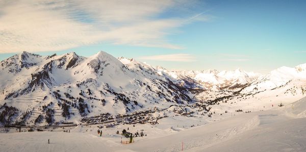 Scenic view of snowcapped mountains against sky