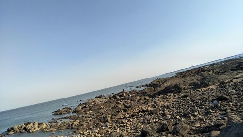 Scenic view of sea against clear blue sky