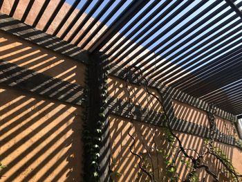 High angle view of metal structure on building during sunny day