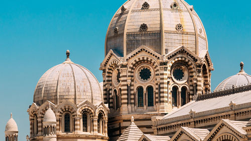 Low angle view of cathedral against clear blue sky