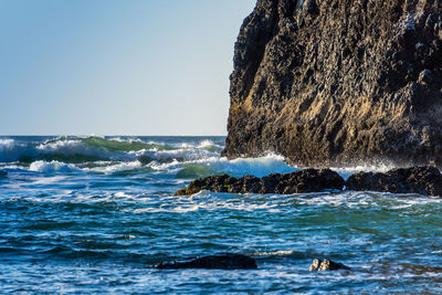 Waves roll in at cannon beach in oregon state.