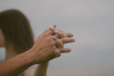 Close-up of woman and man holding hands