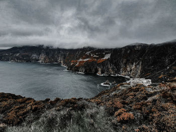 Scenic view of sea against sky during winter