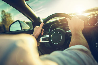 Low section of man driving car