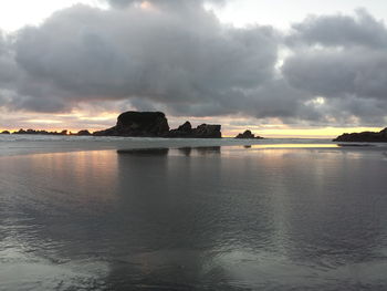 Scenic view of sea against cloudy sky