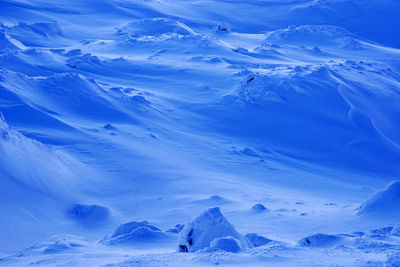 Scenic view of snow covered mountains