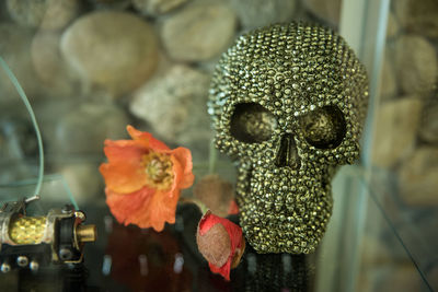 Close-up of human skull centerpiece on table at home