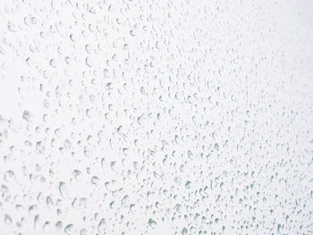 Full frame shot of raindrops on glass