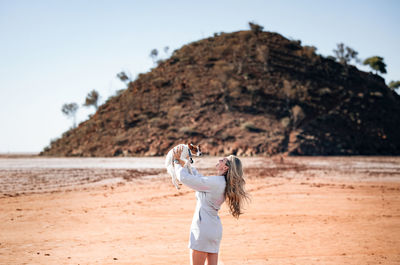 Full length of woman standing on beach